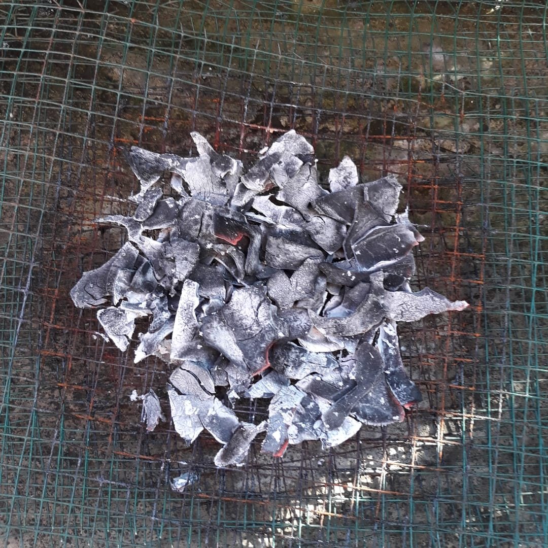 Coconut shell charcoal on wire mesh