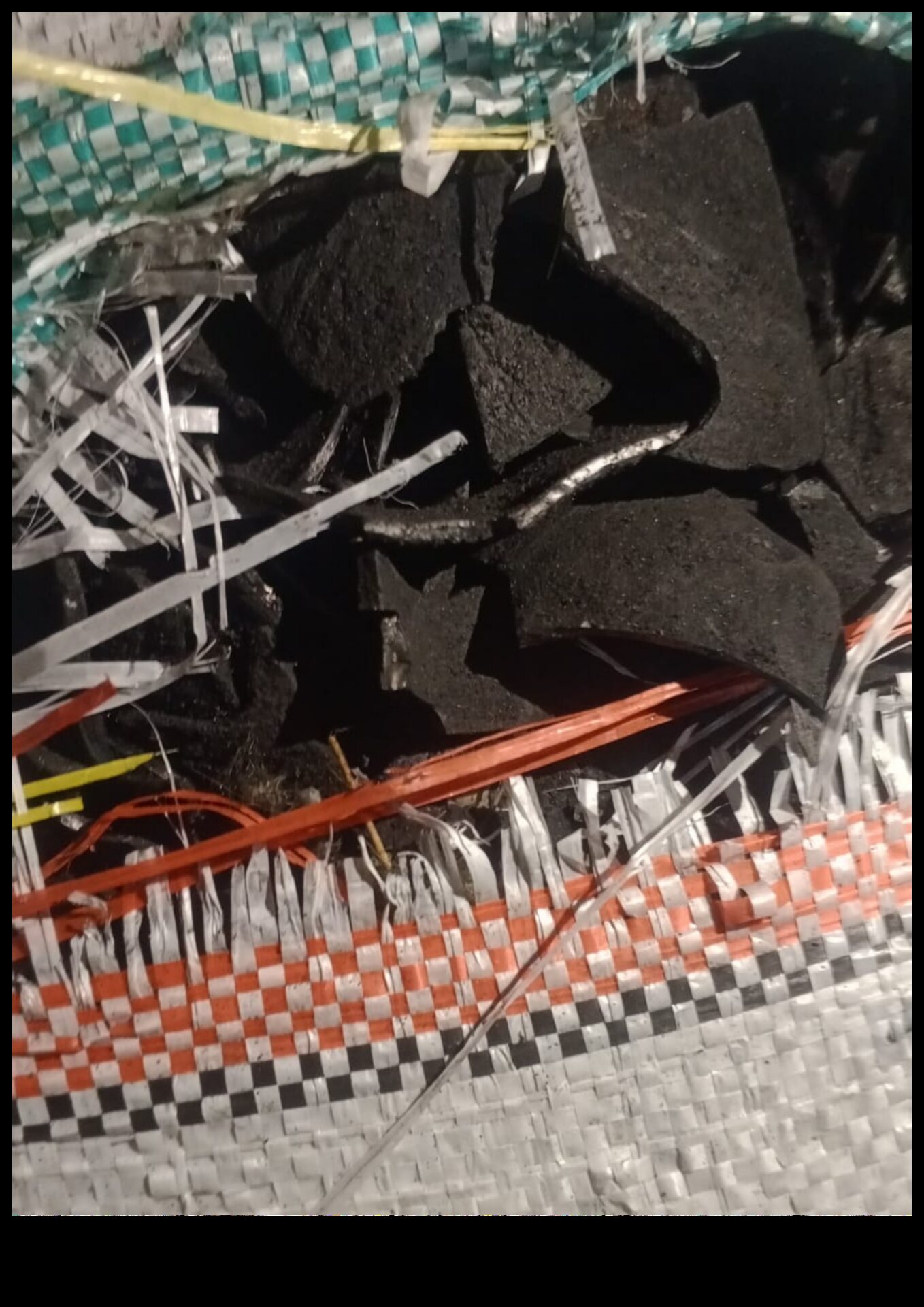 Open sack of coconut shell charcoal pieces