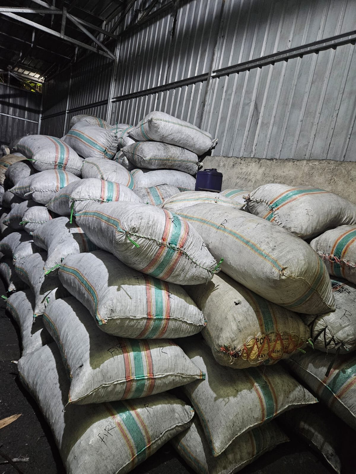 Stacked export sacks in warehouse storage
