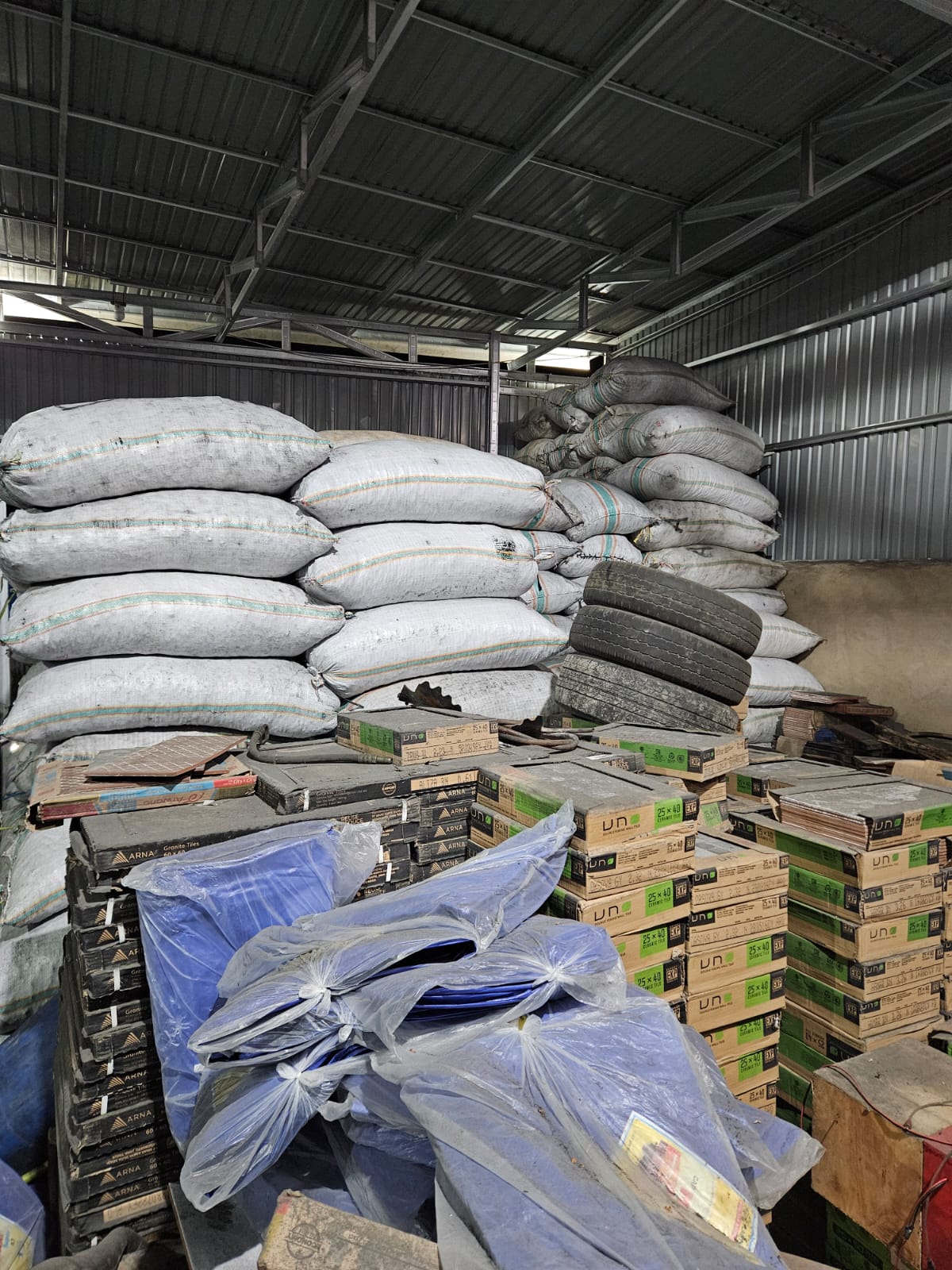 Warehouse interior with tall stacks of white export sacks